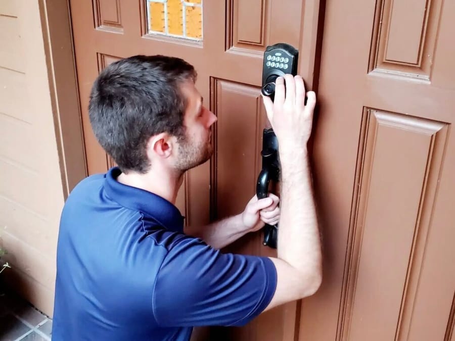 Be Secure Locksmith technician installing a smart lock